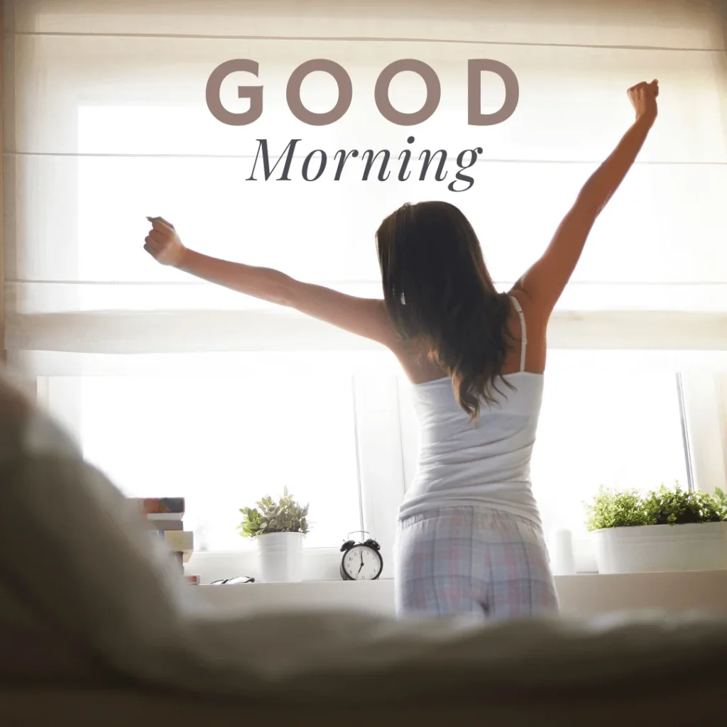 Short hair girl stretching by standing near the window in the morning.png 2