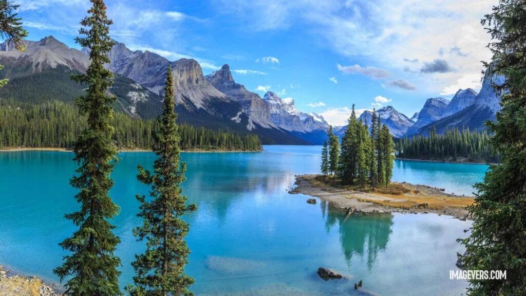 Blue lake in the middle of forest mountains