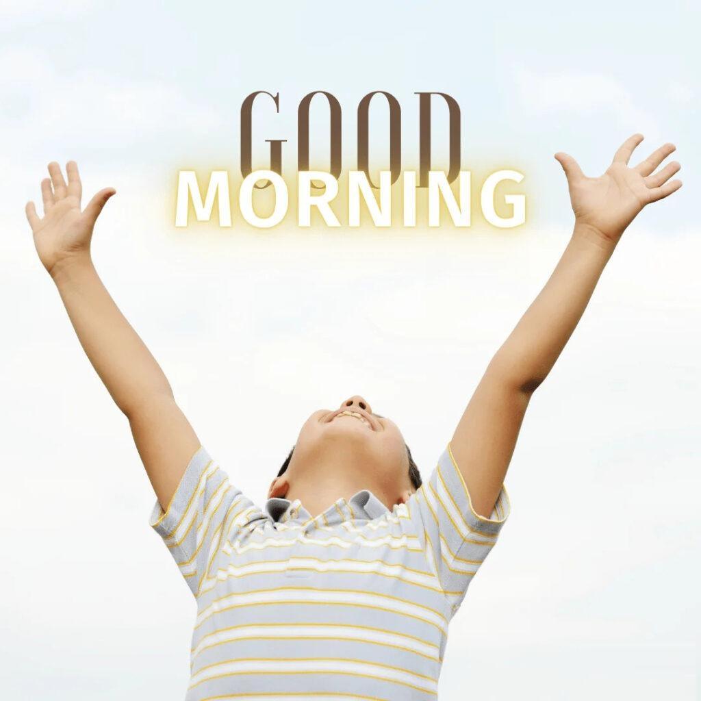 Happy morning a child is looking above with stretched hands.png